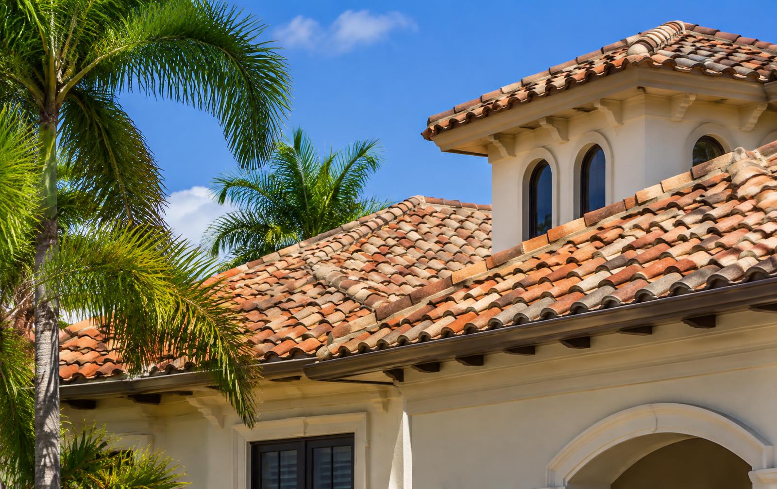 Terracotta and tan barrel tile roof detail on a Mediterranean-style Florida home